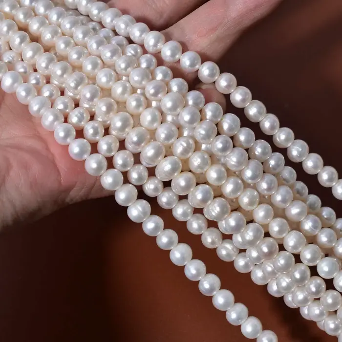 Perles en vrac naturelles d'eau douce blanches nacrées filetées 5-6mm