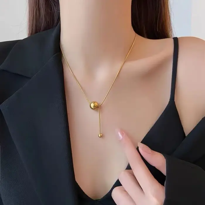 Pendentif boule dorée Simple